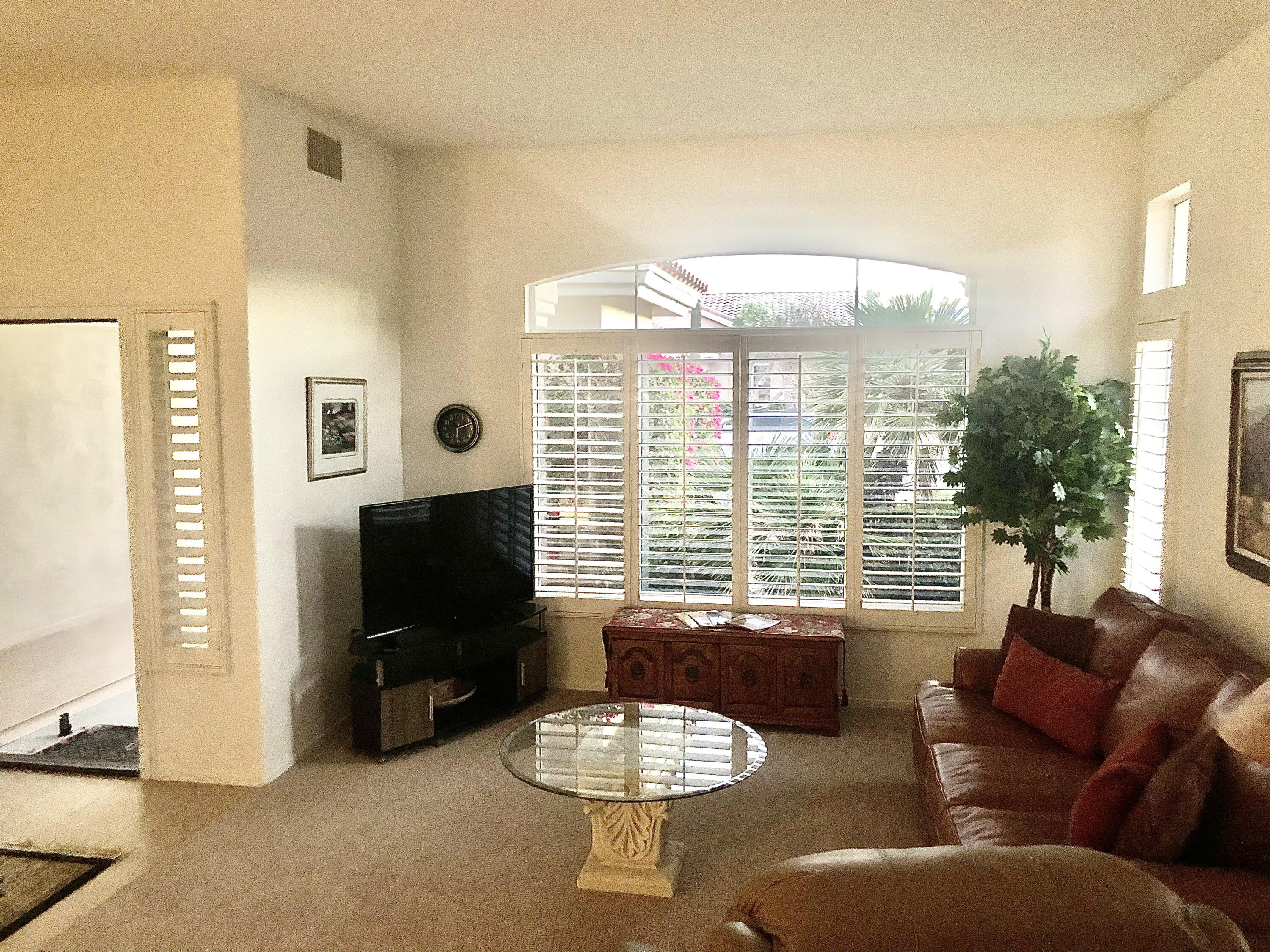 78366 Moongold Road Palm Desert, CA 92211 - Photo 3 of 17 a living room with furniture and a large window