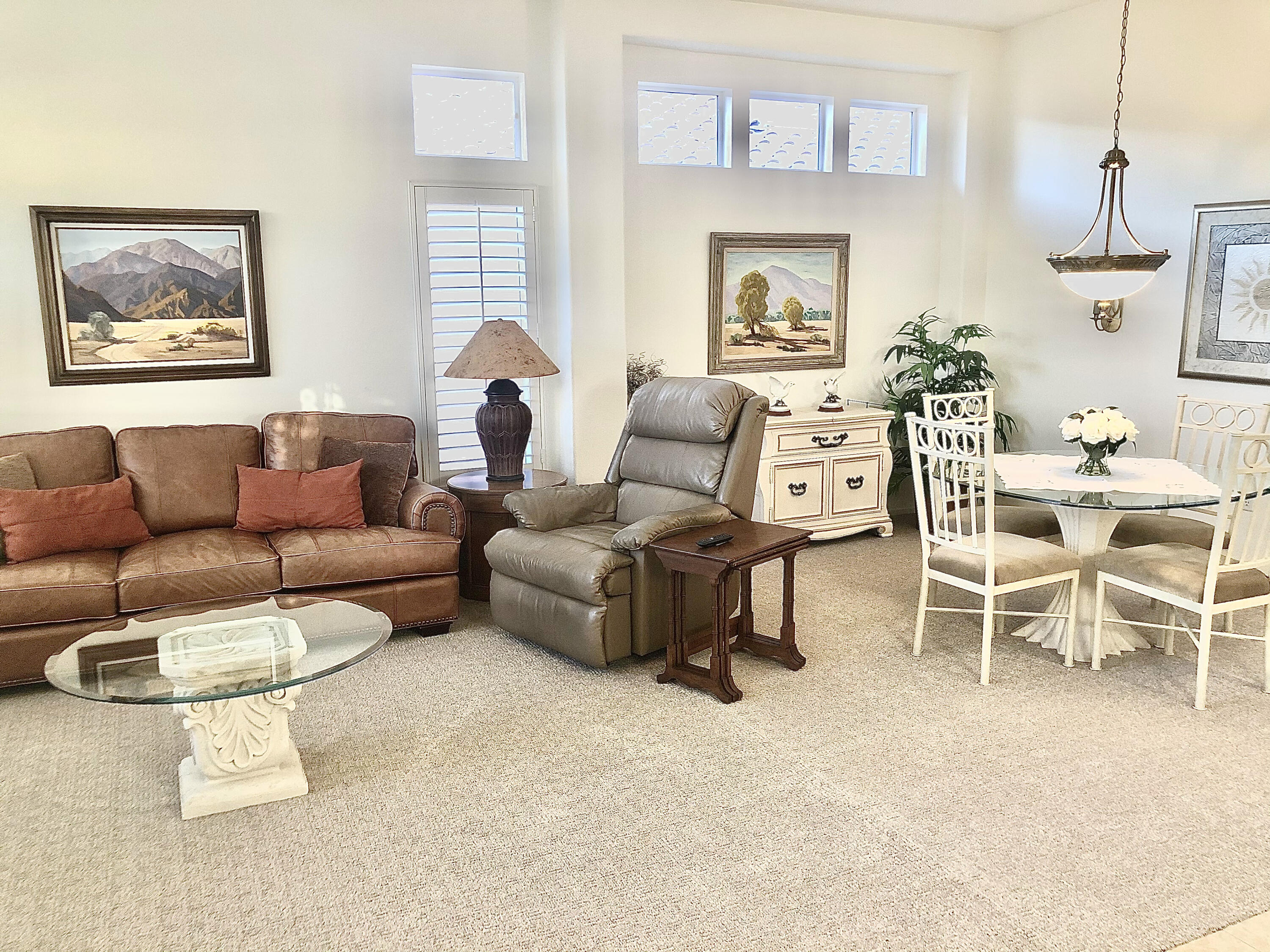 78366 Moongold Road Palm Desert, CA 92211 - Photo 5 of 17 a living room with furniture and a large window
