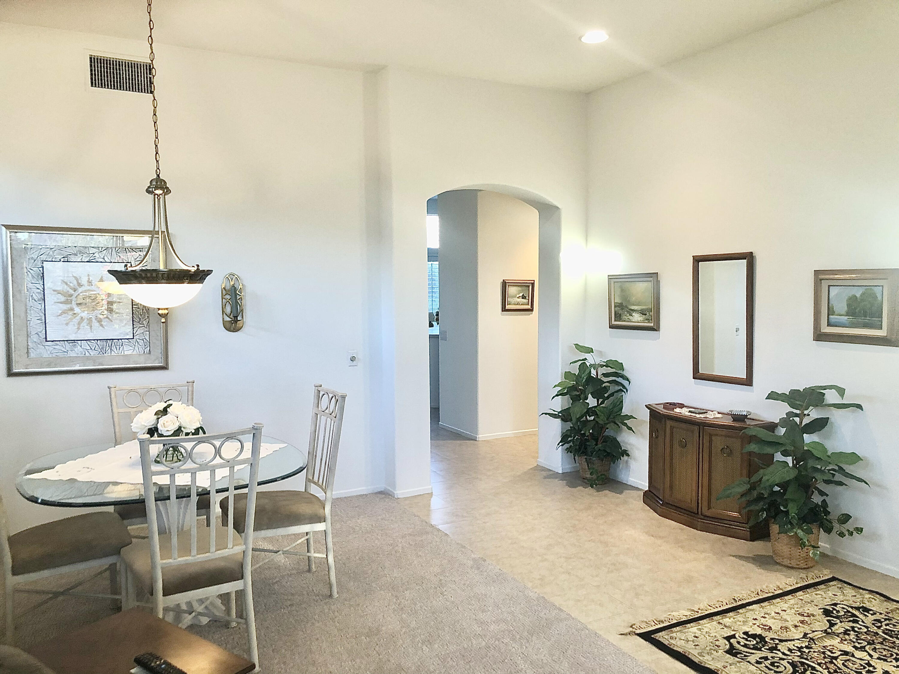 78366 Moongold Road Palm Desert, CA 92211 - Photo 7 of 17 a view of a livingroom with furniture and a table
