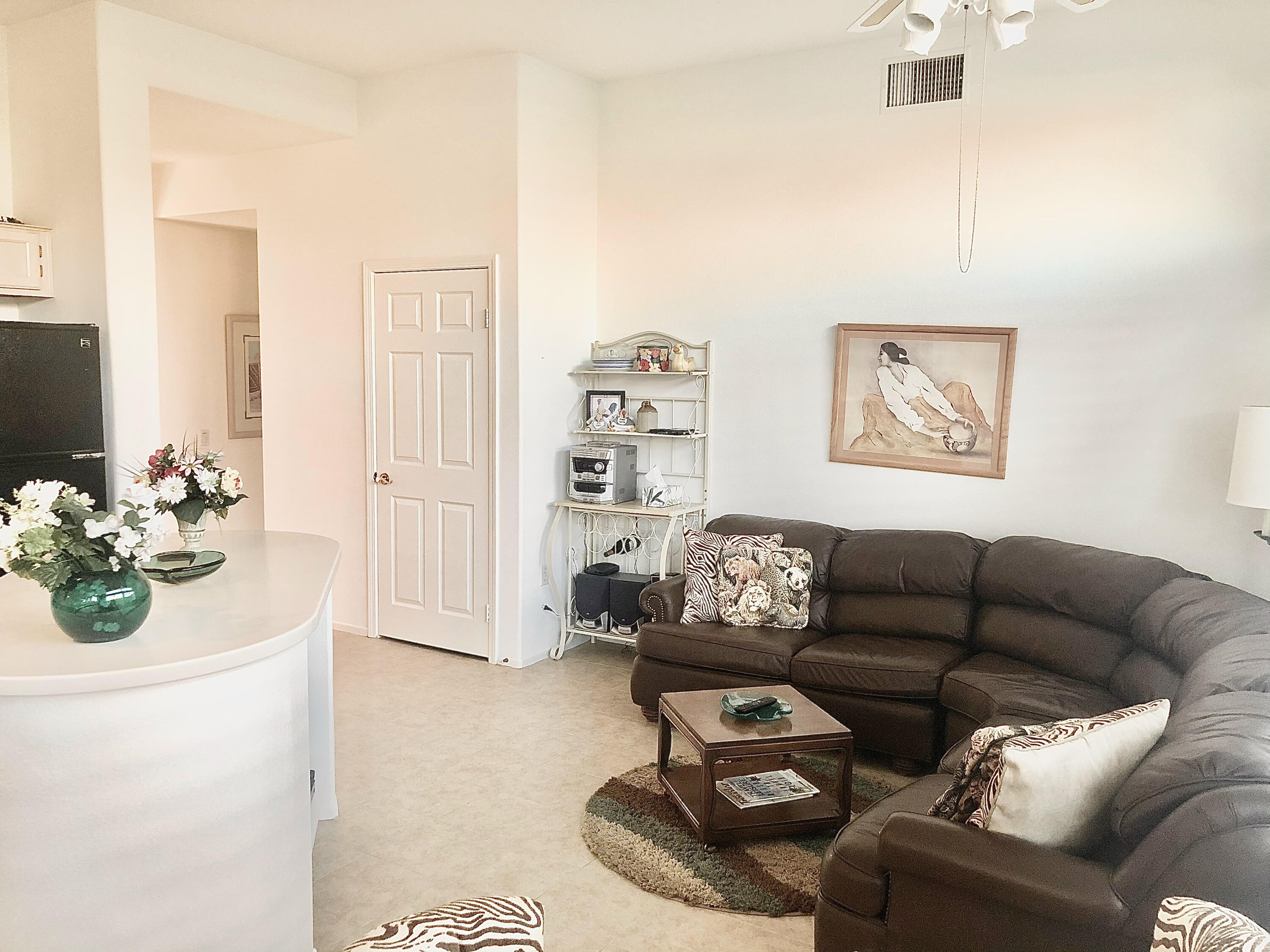 78366 Moongold Road Palm Desert, CA 92211 - Photo 9 of 17 a living room with furniture and a couch