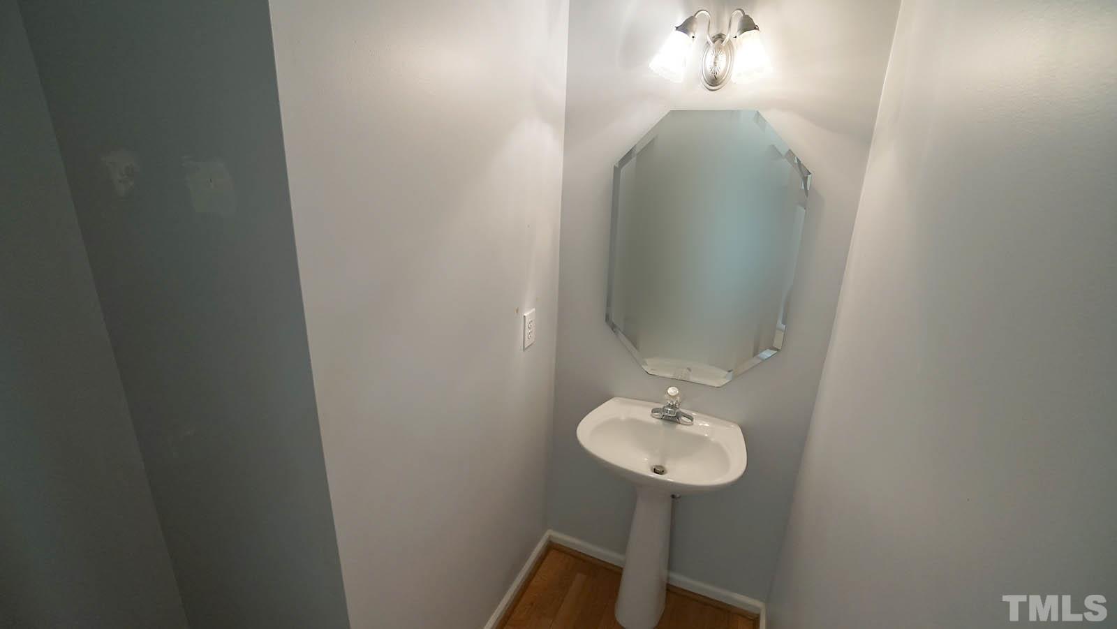 10721 Durant Road Raleigh, NC 27615 - Photo 17 of 37 a bathroom with a sink and mirror