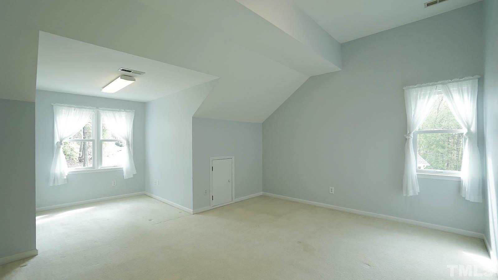 10721 Durant Road Raleigh, NC 27615 - Photo 27 of 37 a view of an empty room with a window