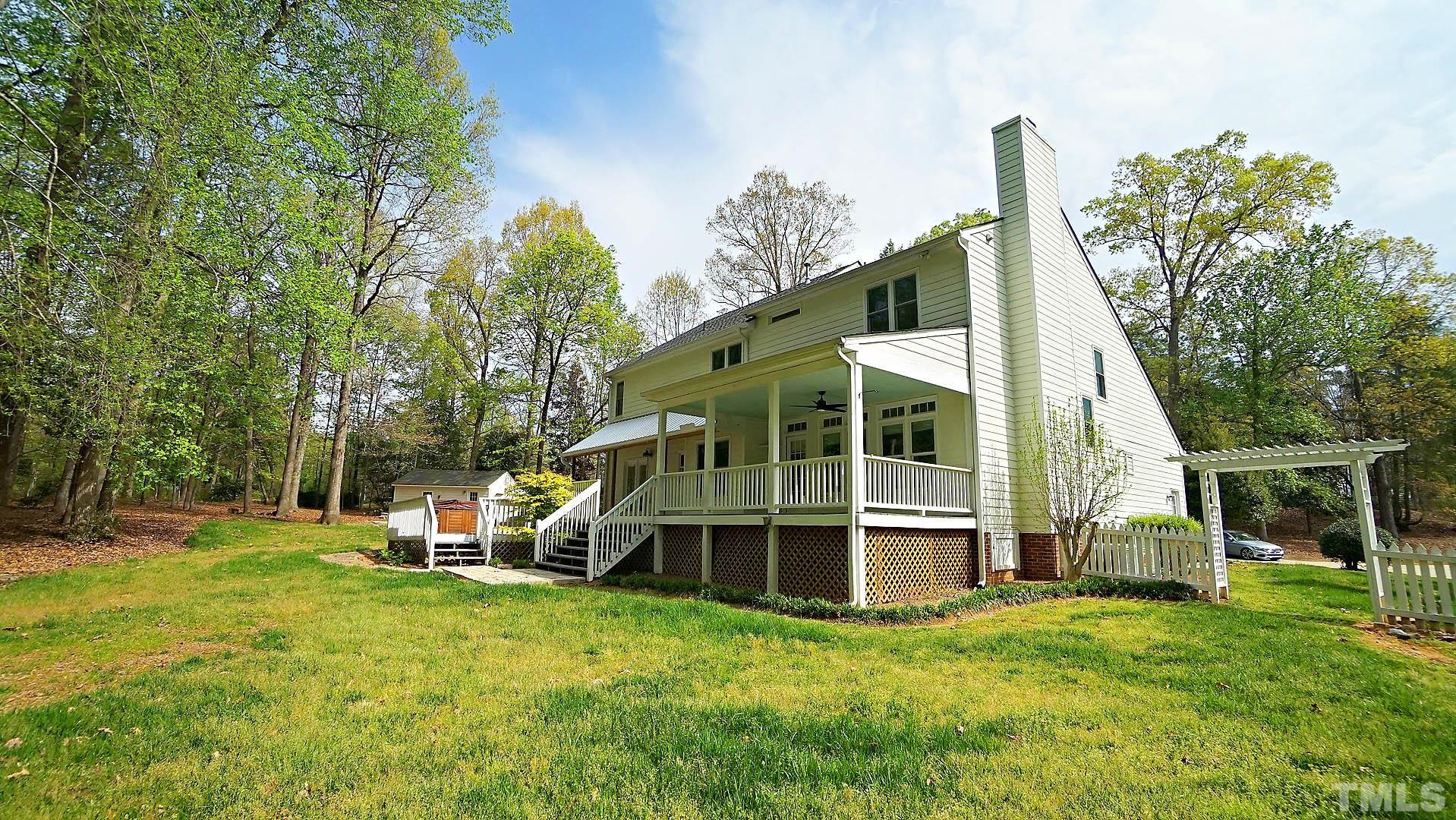 10721 Durant Road Raleigh, NC 27615 - Photo 30 of 37 a front view of a house with a yard and trees