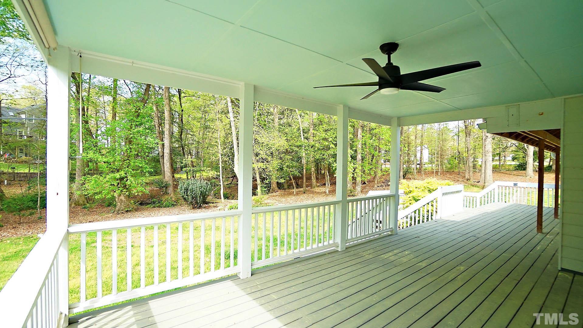 10721 Durant Road Raleigh, NC 27615 - Photo 32 of 37 a view of a porch with wooden floor and outdoor space