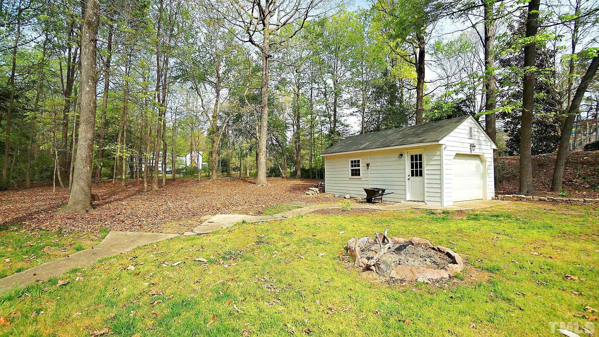 10721 Durant Road Raleigh, NC 27615 - Photo 36 of 37 a view of a house with backyard and trees