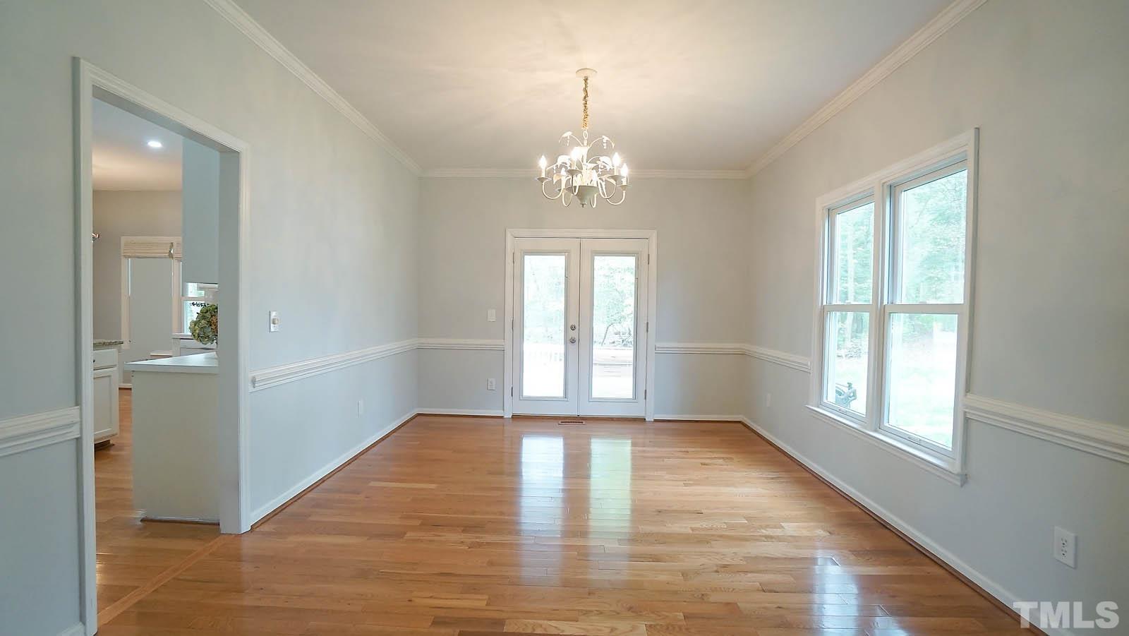 10721 Durant Road Raleigh, NC 27615 - Photo 7 of 37 wooden floor in an empty room with a window