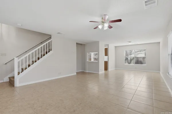 a view interior of a house with an entryway and stairs