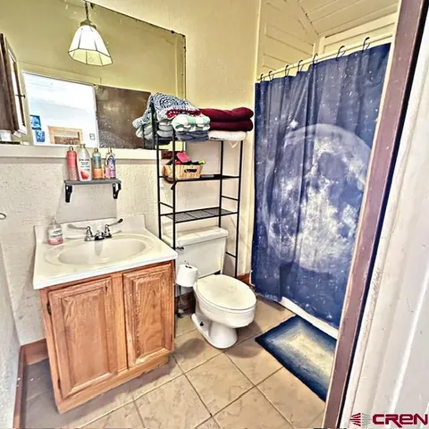 a living room filled with furniture and a rug