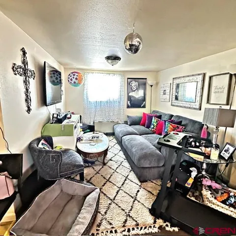 a living room with furniture and a window