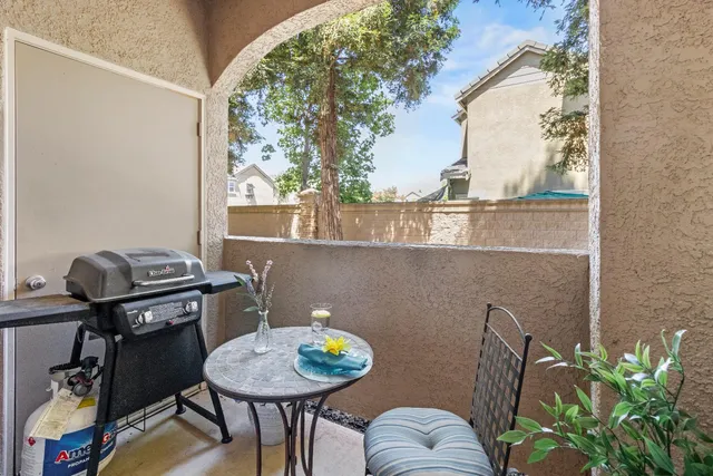 a view of a hallway with wooden floor and stairs