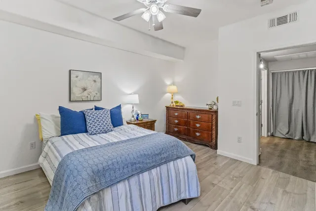 a bed room with a bed and a television