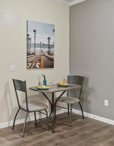 a view of a dining room with furniture and chandelier