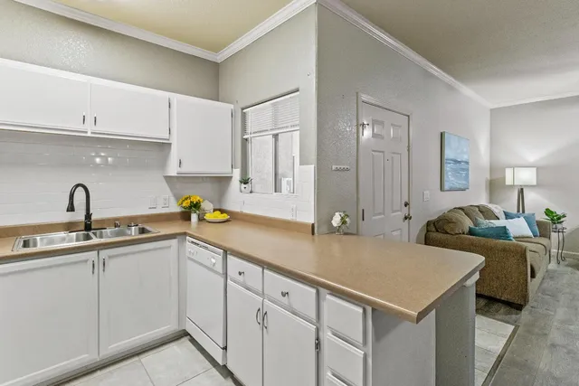 a kitchen with a sink and cabinets