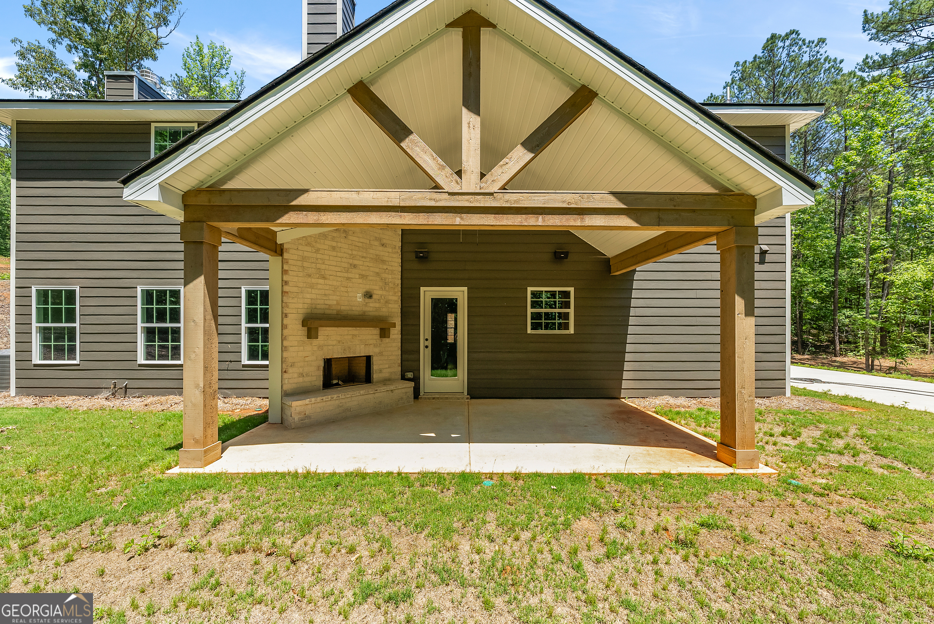 38 Oak Ridge Drive, Unit 26 Waverly Hall, GA 31831 - Photo 37 of 37 a view of a house with backyard