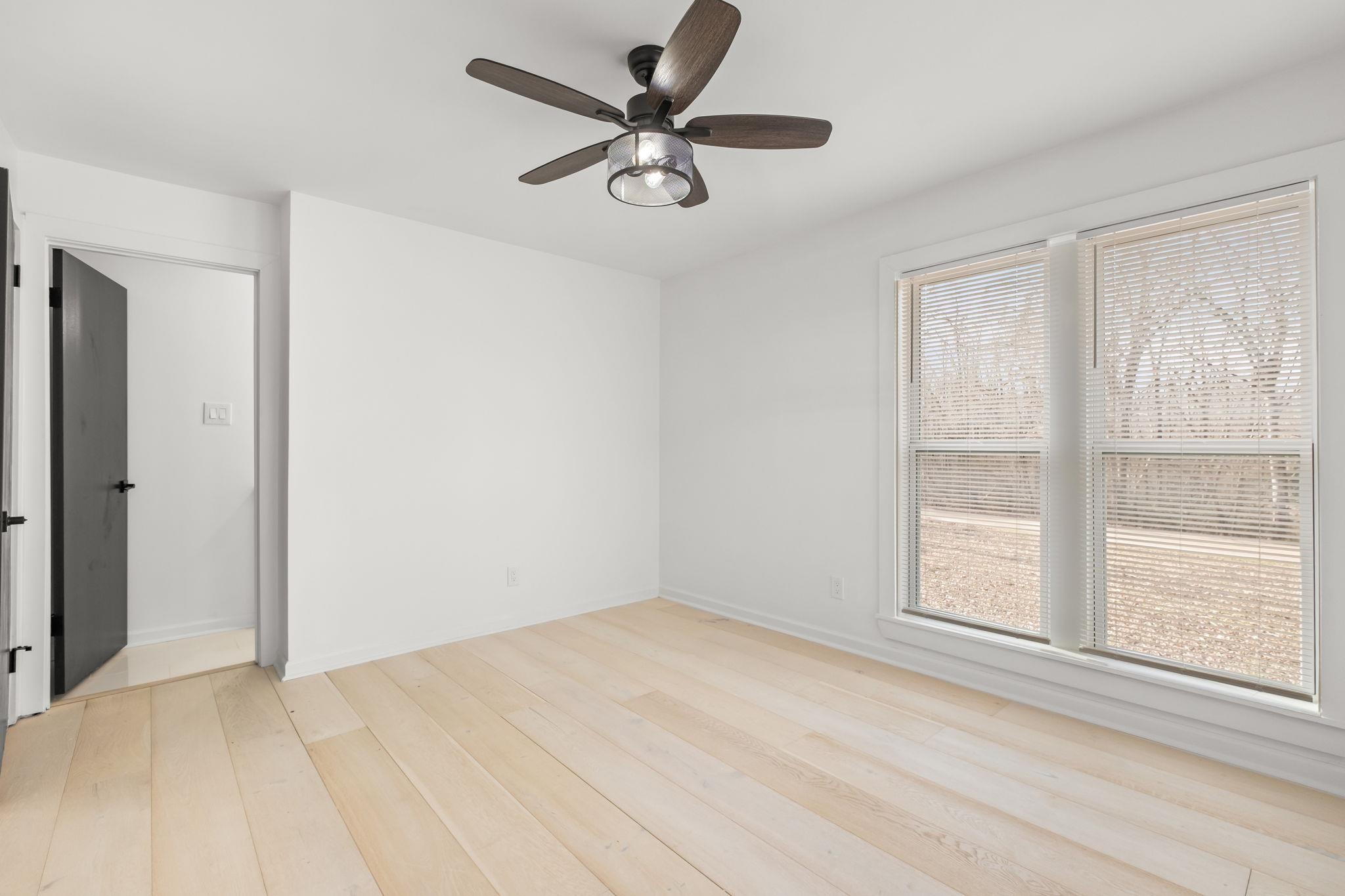 6224 Benjestown Road Memphis, TN 38127 - Photo 26 of 39 Empty room with ceiling fan and light wood-style floors