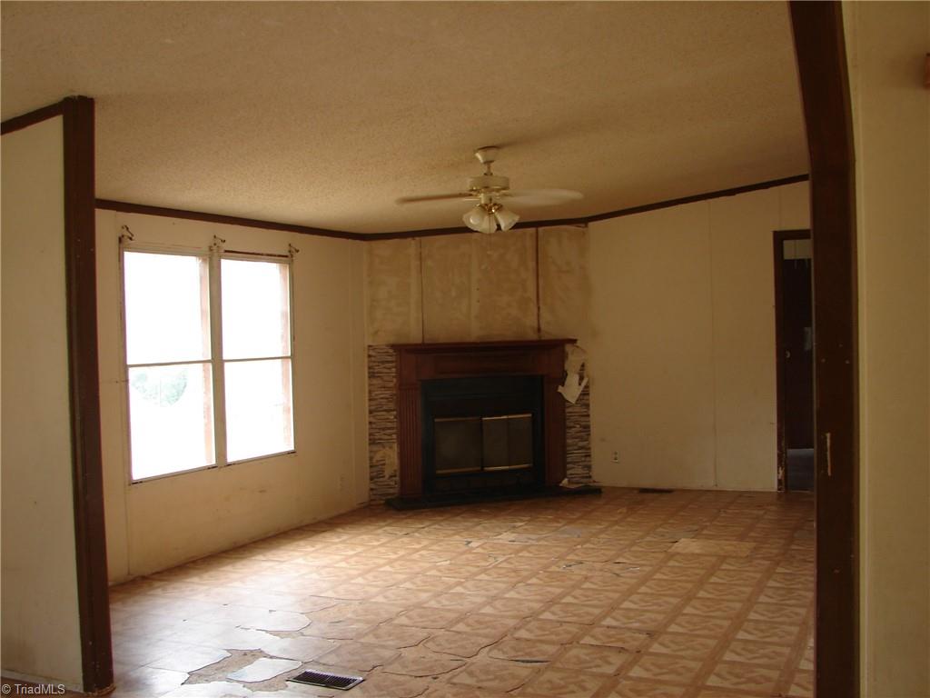 3912 Bethesda Road Lexington, NC 27295 - Photo 4 of 19 Den with fireplace
