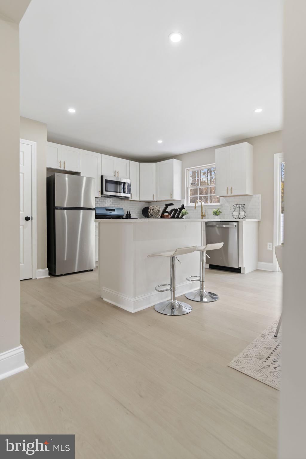 20 Elks Trail New Castle, DE 19720 - Photo 12 of 40 a kitchen with refrigerator and cabinets