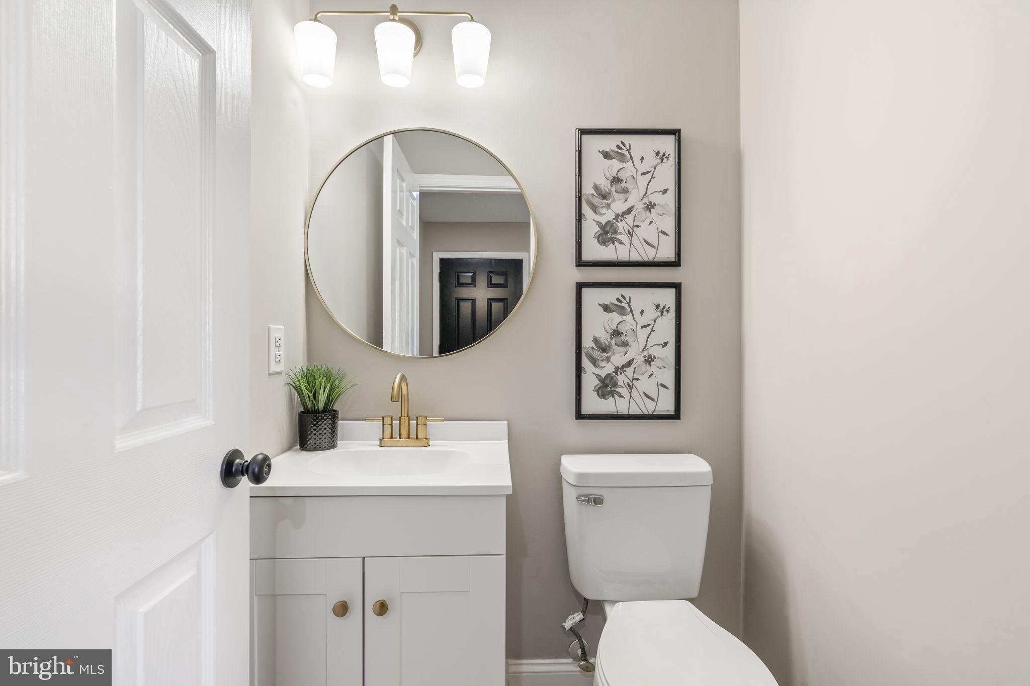 20 Elks Trail New Castle, DE 19720 - Photo 20 of 40 a bathroom with a toilet a sink and mirror