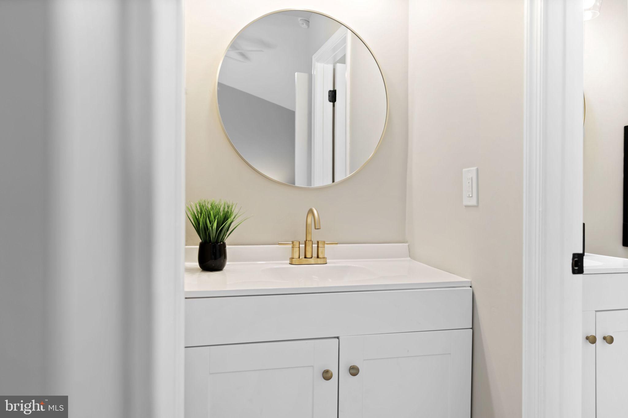 20 Elks Trail New Castle, DE 19720 - Photo 28 of 40 a bathroom with a sink and a mirror