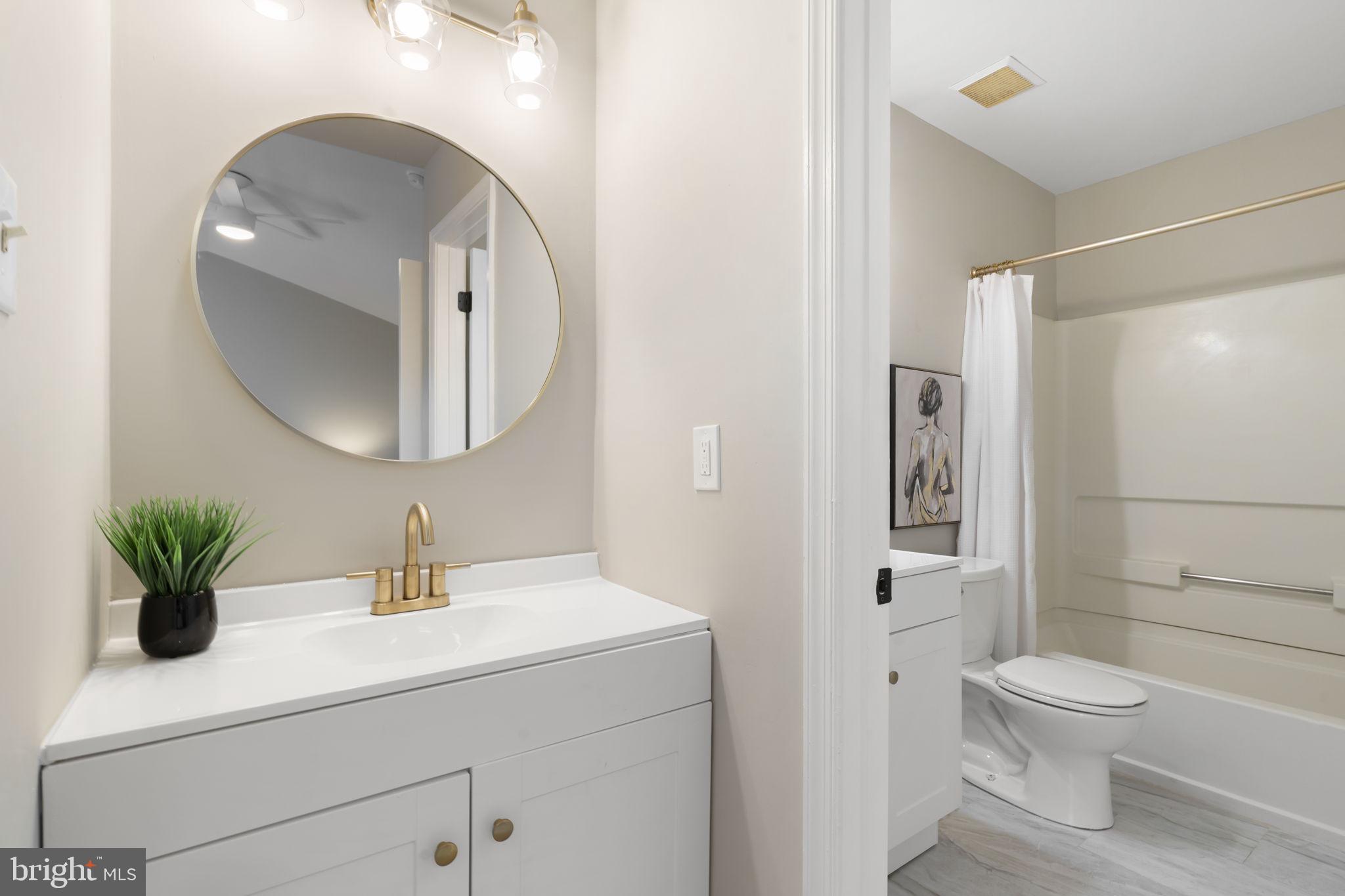 20 Elks Trail New Castle, DE 19720 - Photo 30 of 40 a bathroom with a toilet a sink and mirror