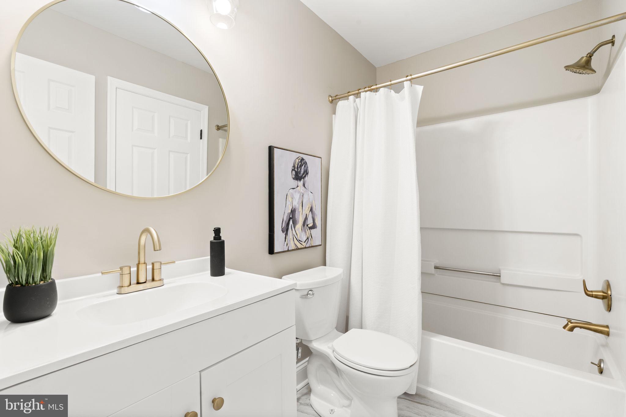 20 Elks Trail New Castle, DE 19720 - Photo 31 of 40 a bathroom with a sink a toilet and a mirror
