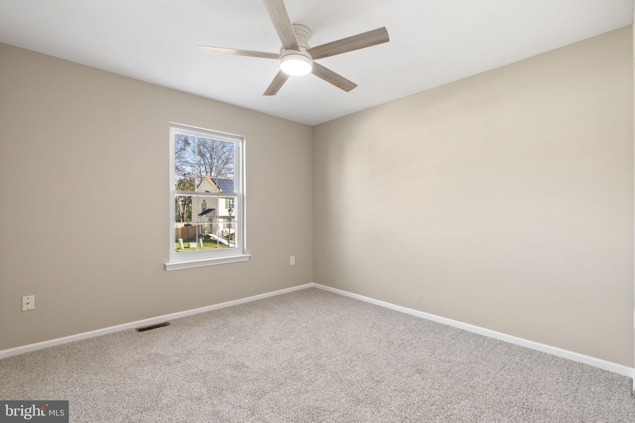 20 Elks Trail New Castle, DE 19720 - Photo 33 of 40 an empty room with a window and a fan
