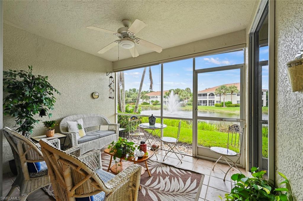 23800 Costa Del Sol Road, Unit 102 Estero, FL 34135 - Photo 3 of 49 Sunroom / solarium featuring a water view and ceiling fan
