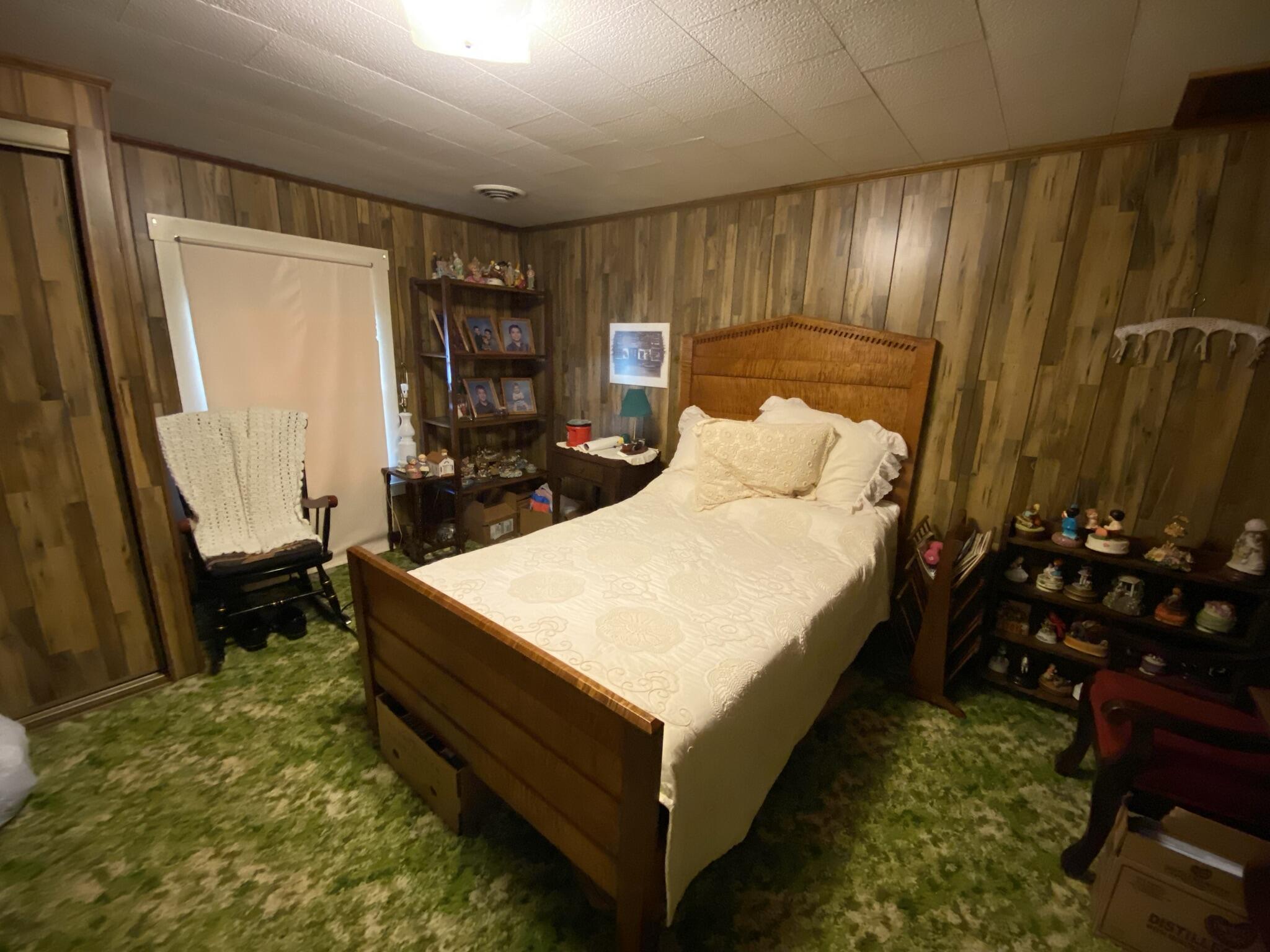 759 Runnett Bag Road Ferrum, VA 24088 - Photo 13 of 74 a bed room with a bed tv and a window
