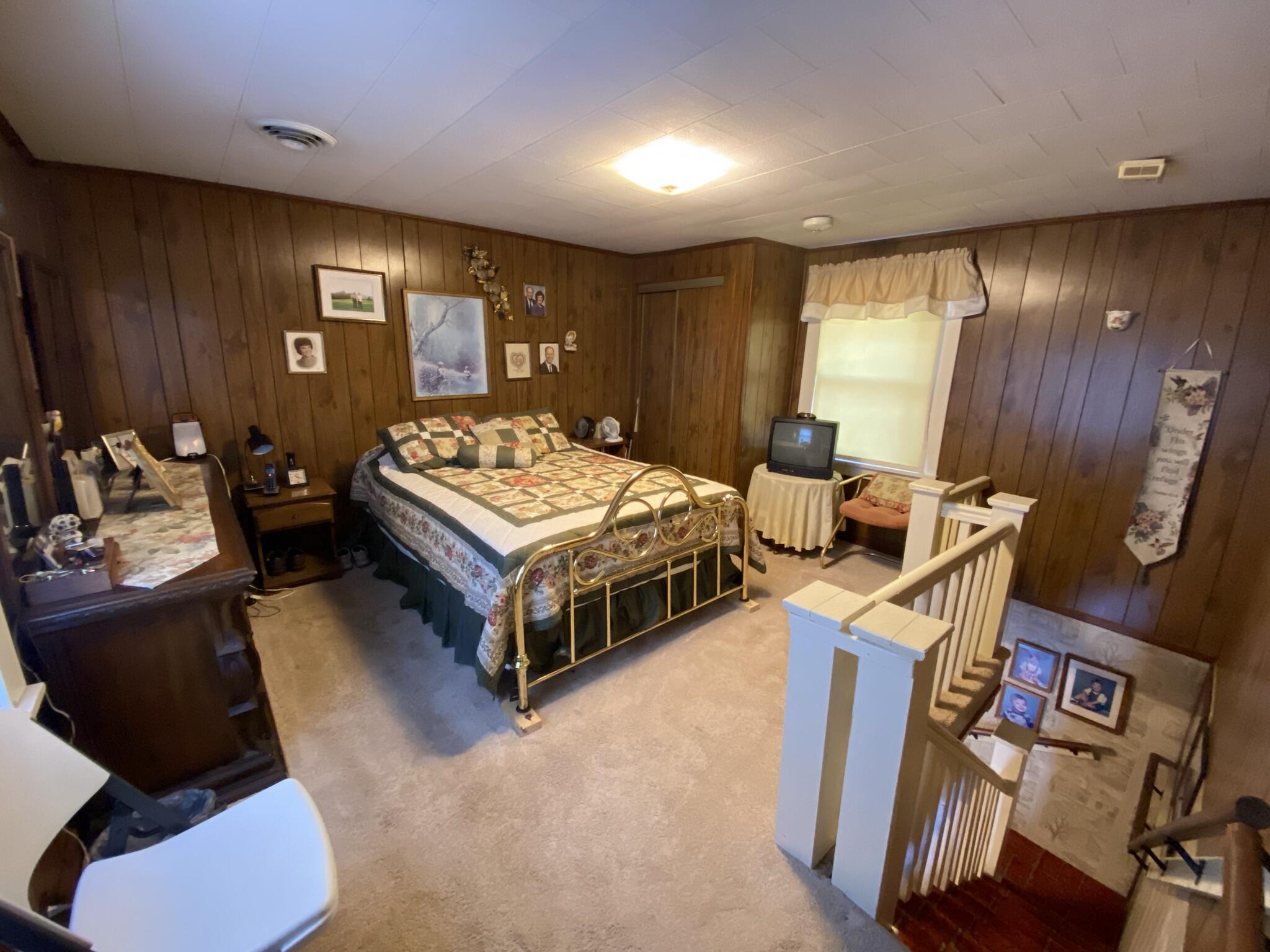 759 Runnett Bag Road Ferrum, VA 24088 - Photo 18 of 74 a bedroom with bed and a large window