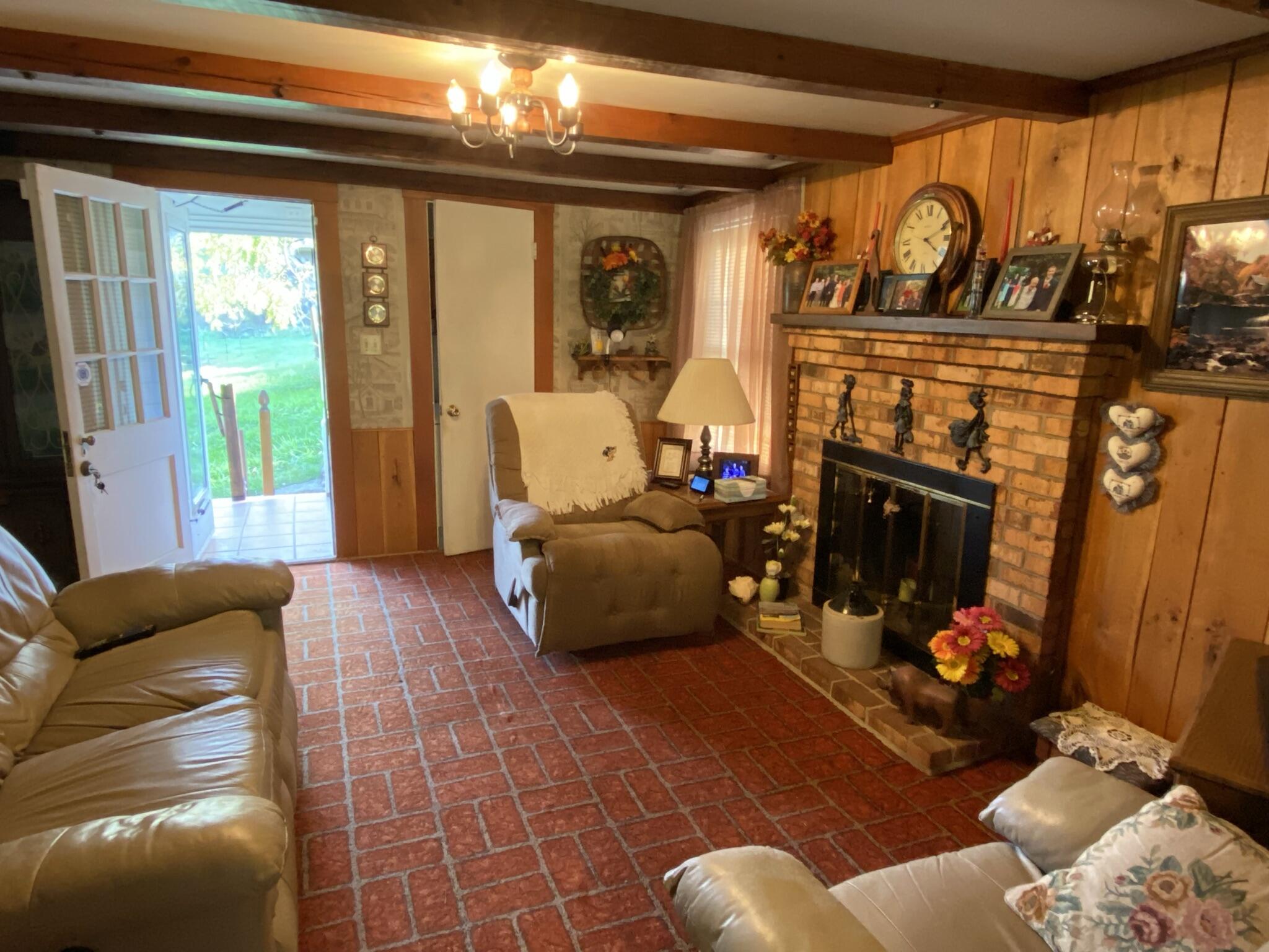 759 Runnett Bag Road Ferrum, VA 24088 - Photo 38 of 74 a living room with furniture a fireplace and a window