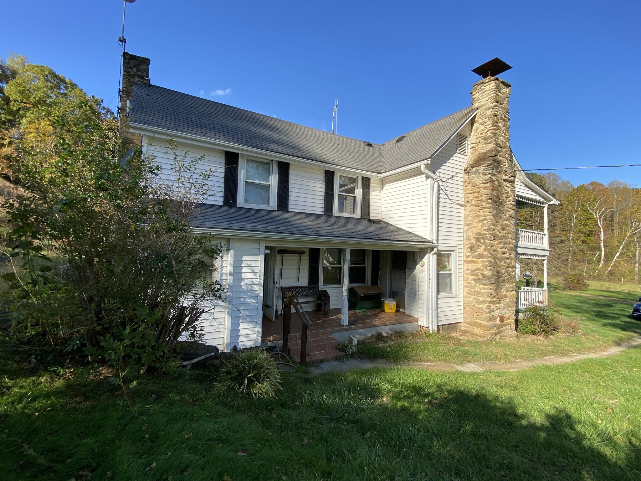 759 Runnett Bag Road Ferrum, VA 24088 - Photo 53 of 74 a view of a house with a yard