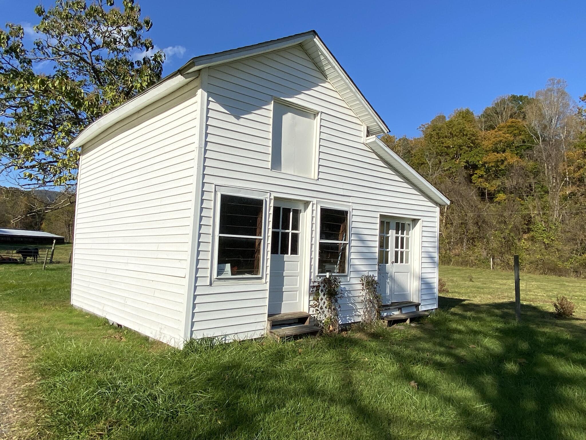 759 Runnett Bag Road Ferrum, VA 24088 - Photo 59 of 74 a view of a house with a yard