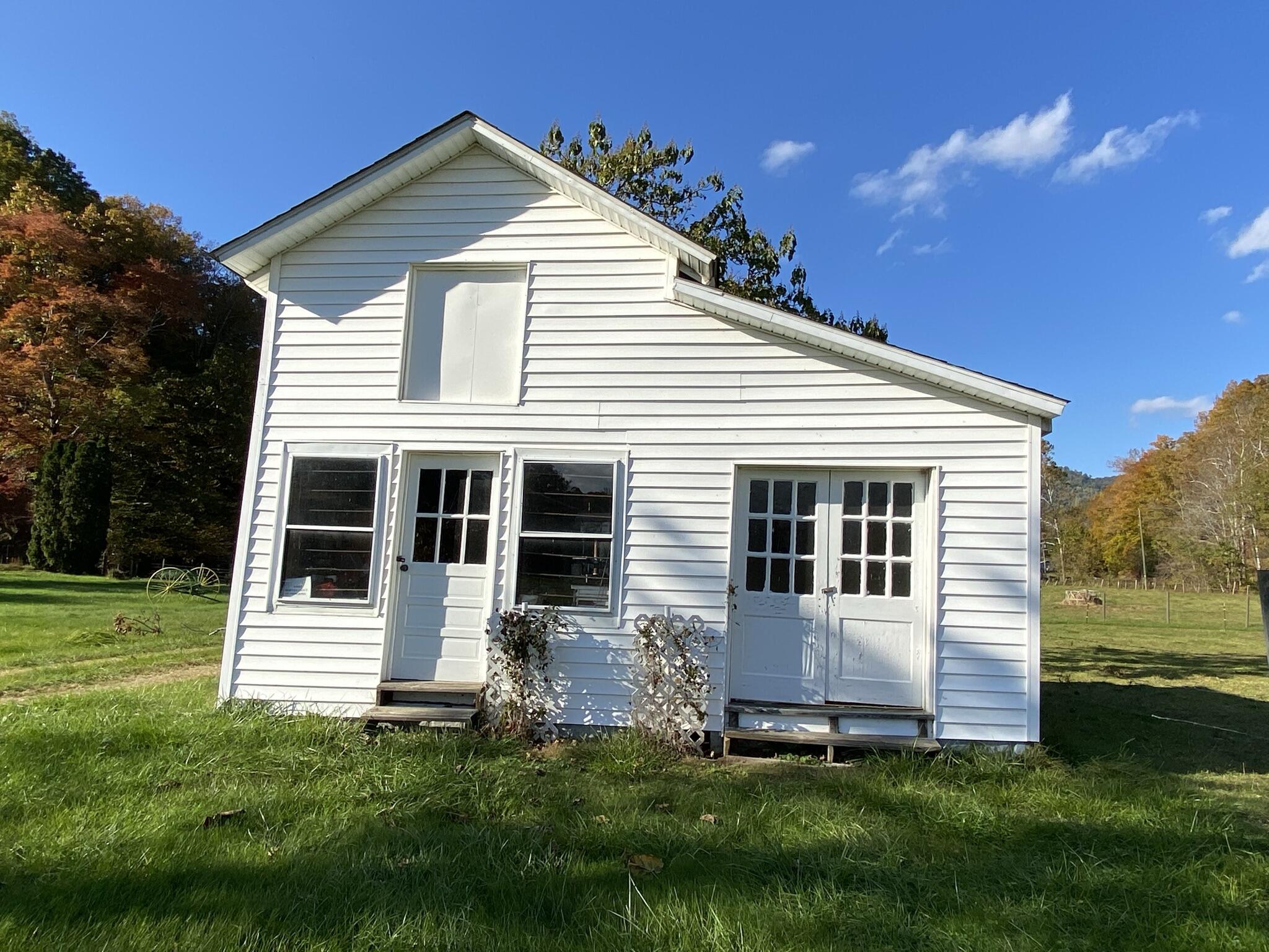 759 Runnett Bag Road Ferrum, VA 24088 - Photo 60 of 74 a front view of a house with a yard