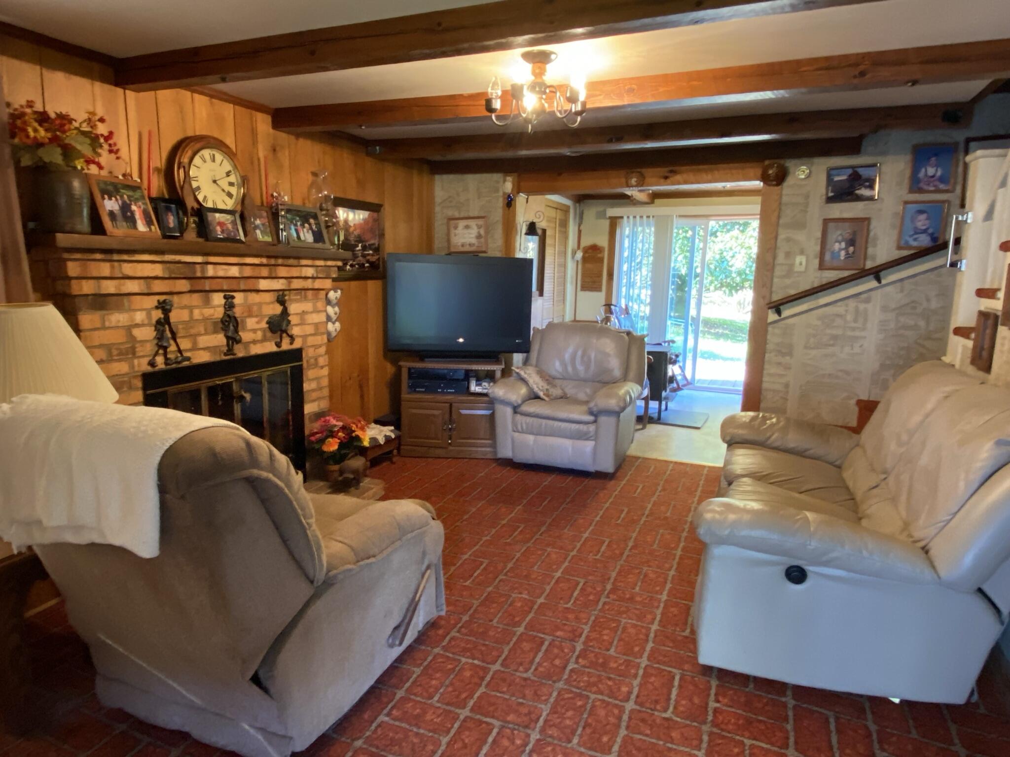 759 Runnett Bag Road Ferrum, VA 24088 - Photo 7 of 74 a living room with furniture a fireplace and a flat screen tv