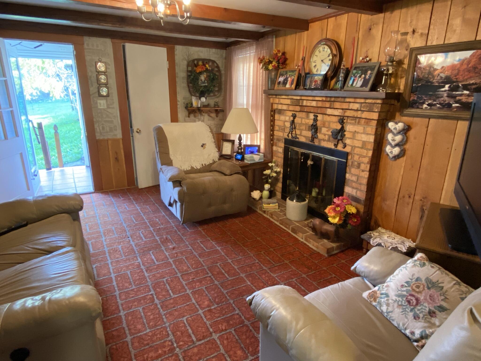 759 Runnett Bag Road Ferrum, VA 24088 - Photo 8 of 74 a living room with furniture a flat screen tv and a fireplace