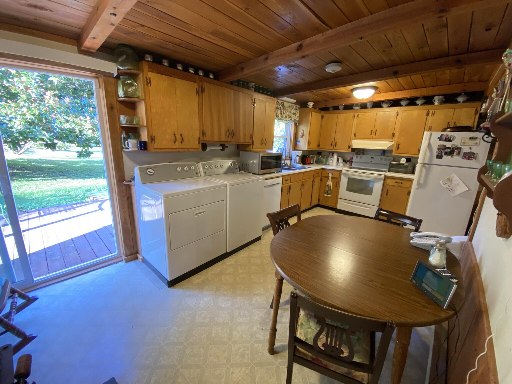 759 Runnett Bag Road Ferrum, VA 24088 - Photo 9 of 74 a view of a kitchen with a sink and a microwave