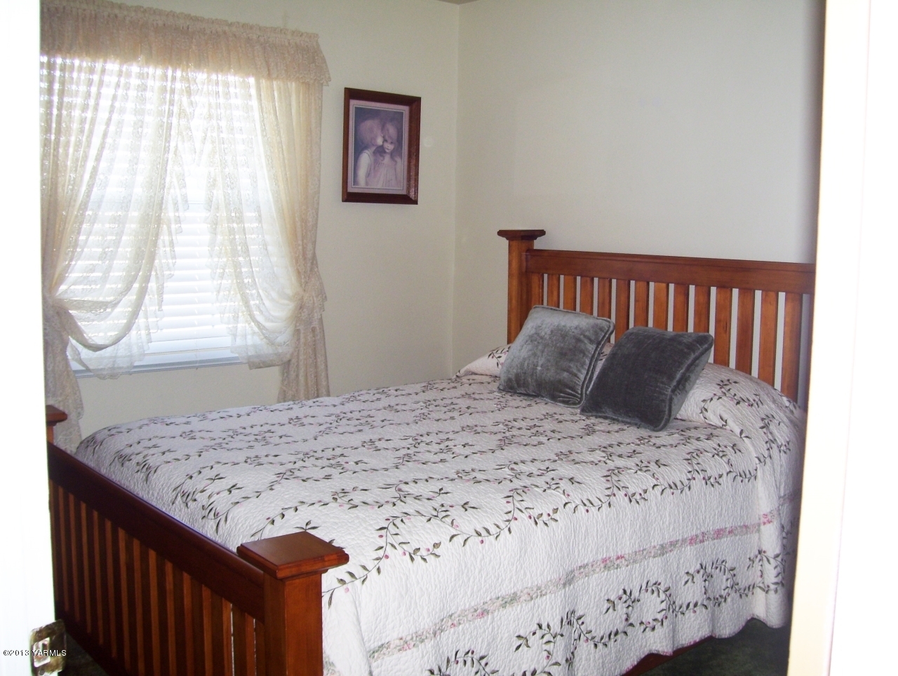 1401 Franklin Road Tieton, WA 98947 - Photo 14 of 20 a bed sitting in a bedroom next to a window