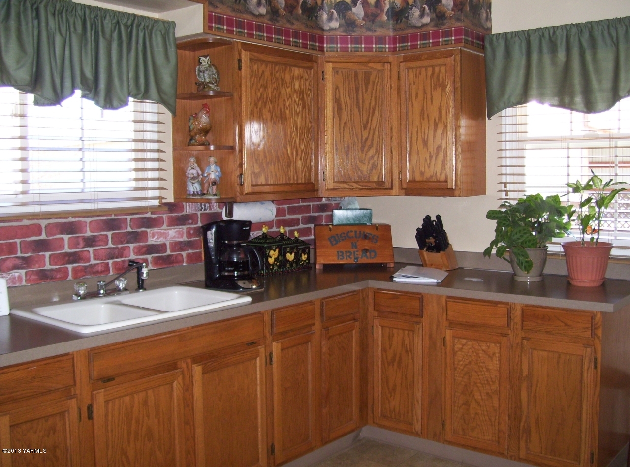 1401 Franklin Road Tieton, WA 98947 - Photo 9 of 20 a kitchen with a sink cabinets and window