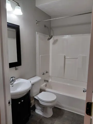 a bathroom with a toilet sink and bathtub