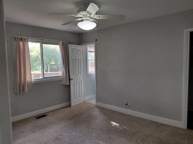 a view of an empty room with a window