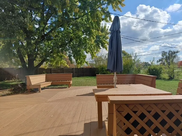 a view of backyard with sitting area