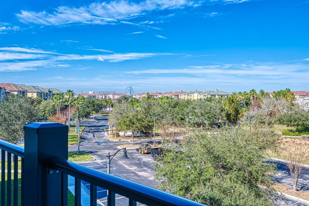 4013 Breakview Drive, Unit A407 Orlando, FL 32819 - Photo 12 of 32 a view of a lake from a balcony with furniture