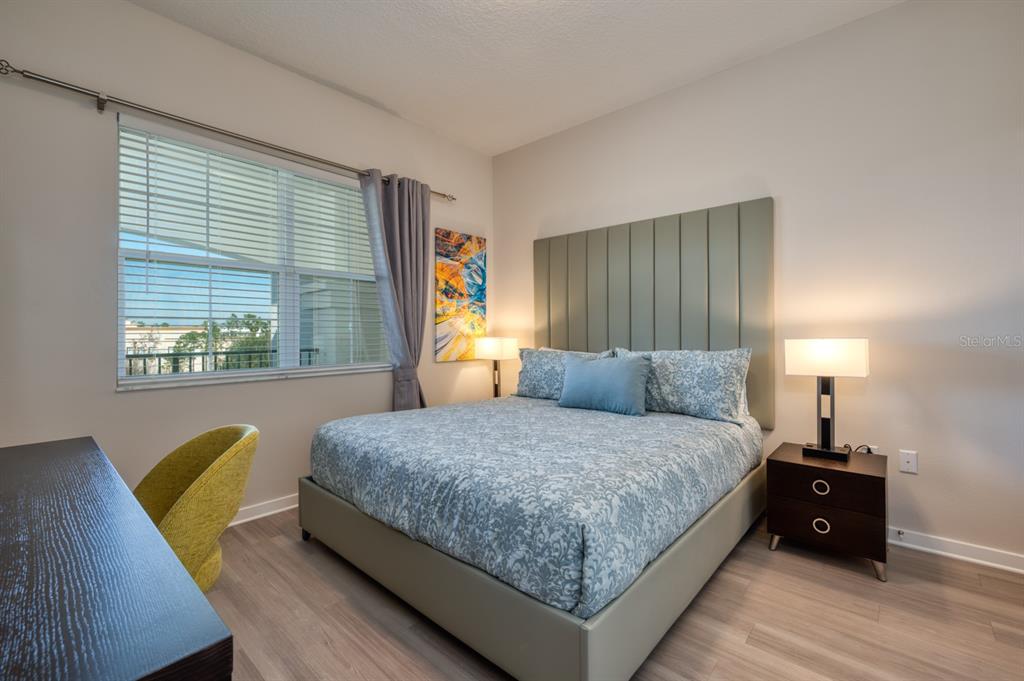 4013 Breakview Drive, Unit A407 Orlando, FL 32819 - Photo 17 of 32 a bedroom with a bed and window