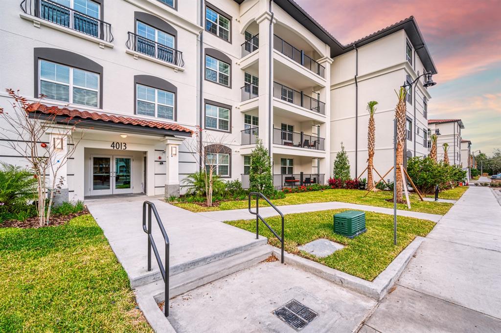 4013 Breakview Drive, Unit A407 Orlando, FL 32819 - Photo 2 of 32 a view of a house with a swimming pool