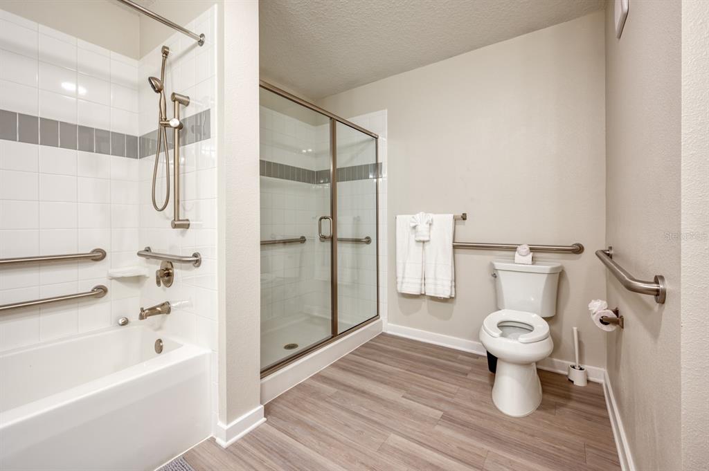 4013 Breakview Drive, Unit A407 Orlando, FL 32819 - Photo 22 of 32 a bathroom with a toilet sink and a shower