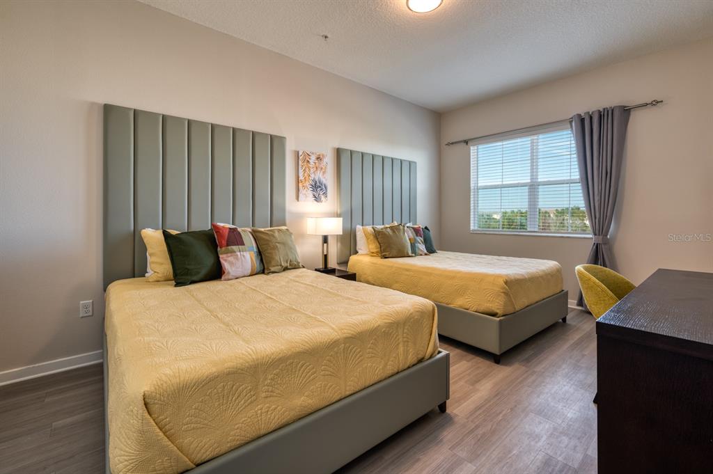 4013 Breakview Drive, Unit A407 Orlando, FL 32819 - Photo 25 of 32 a bedroom with bed and window