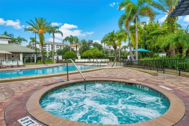 a view of a swimming pool with a patio