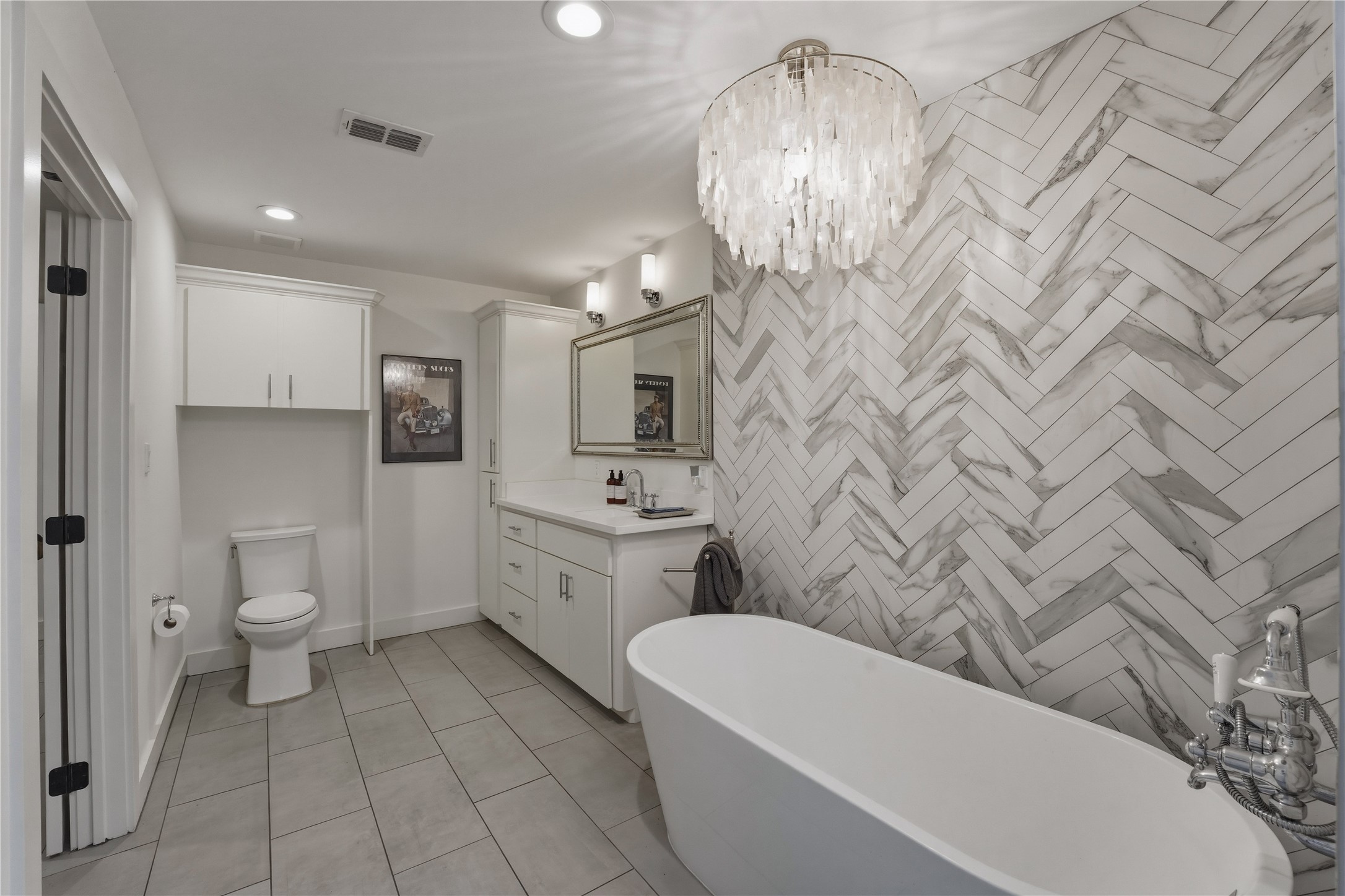 1124 Bowie Street Columbus, TX 78934 - Photo 15 of 28 a bathroom with a toilet sink and mirror
