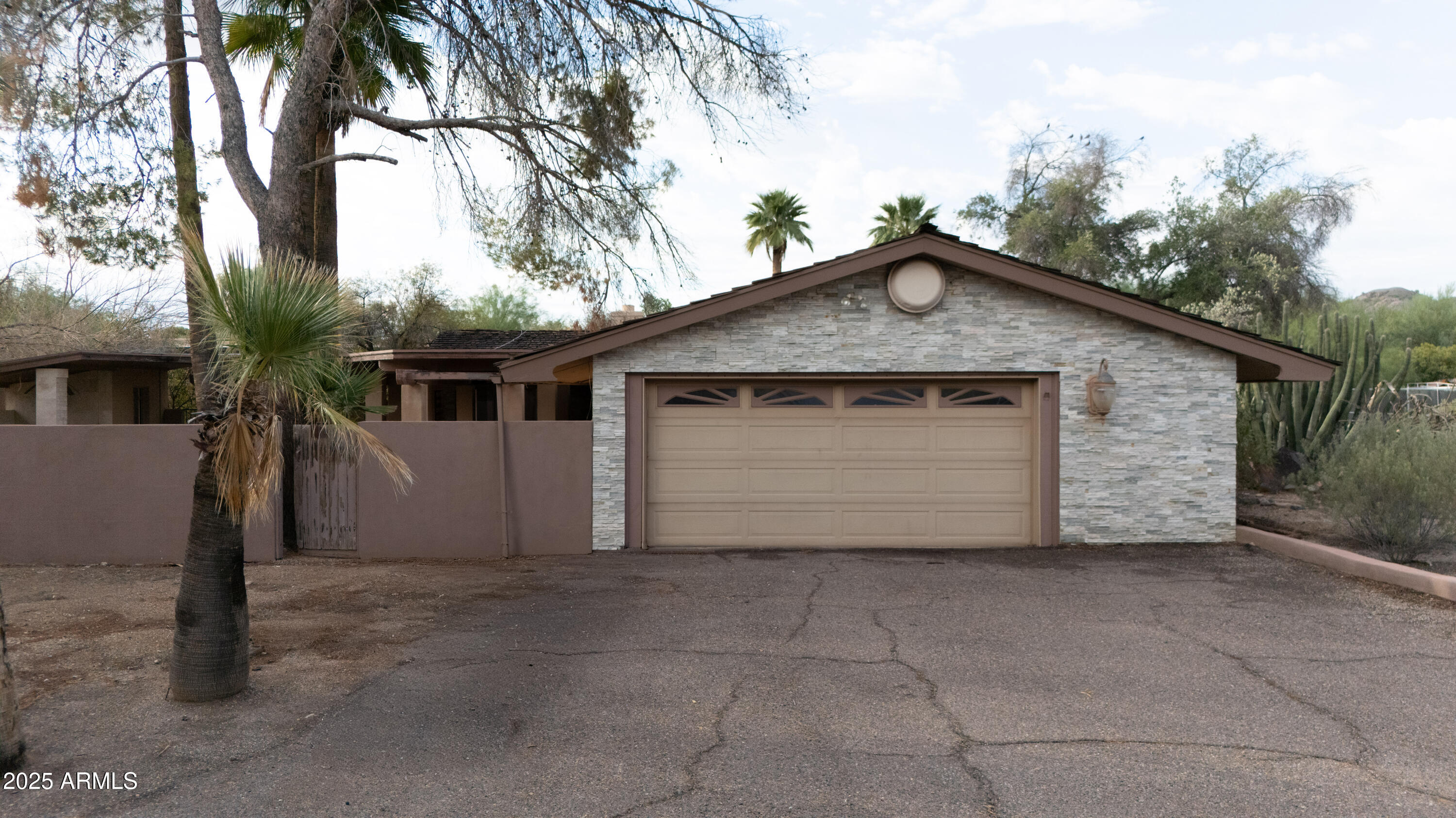 a front view of a house with a garage