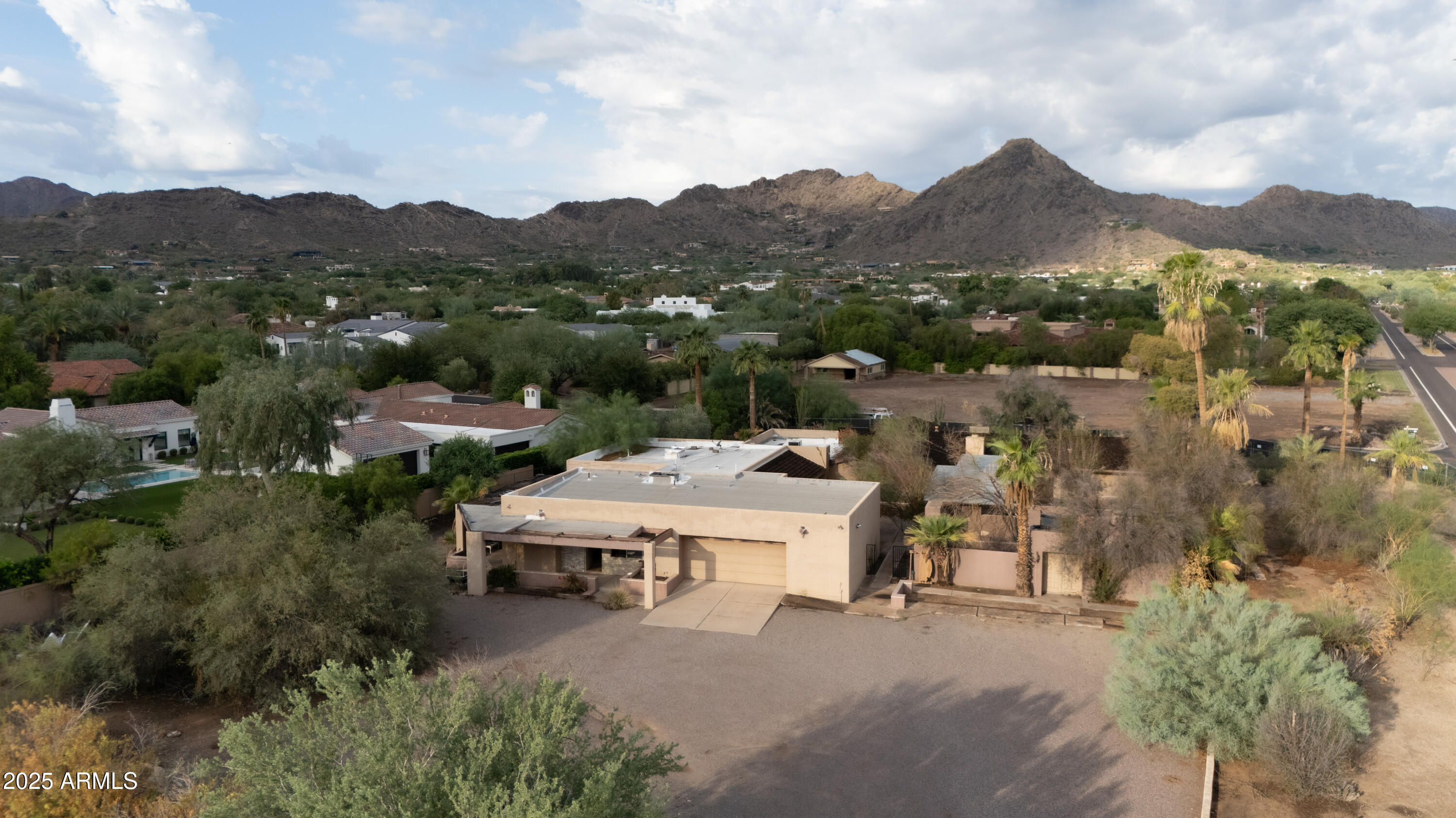 6701 East Mockingbird Lane Paradise Valley, AZ 85253 - Photo 2 of 5 an aerial view of a house with mountain view